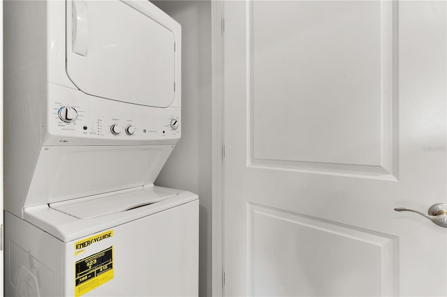 washroom featuring stacked washer and dryer