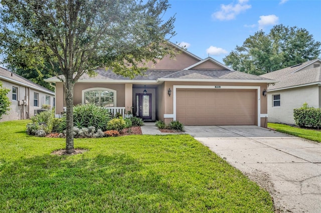 view of front of home featuring a garage and a front yard