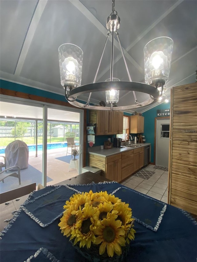 kitchen featuring stainless steel dishwasher, light tile patterned flooring, sink, and a wealth of natural light