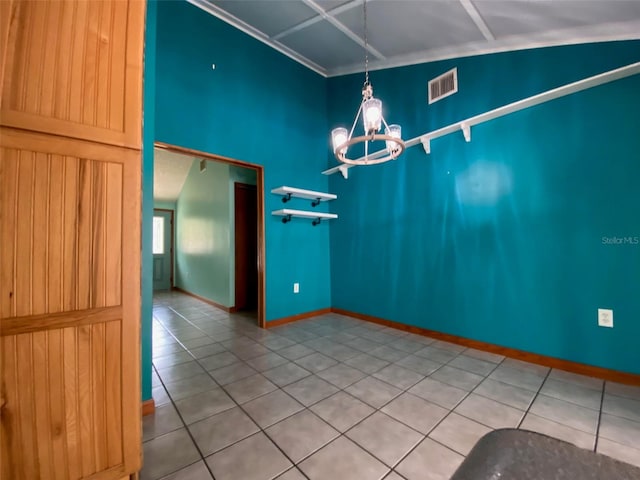 unfurnished dining area with a chandelier, vaulted ceiling, and tile patterned flooring