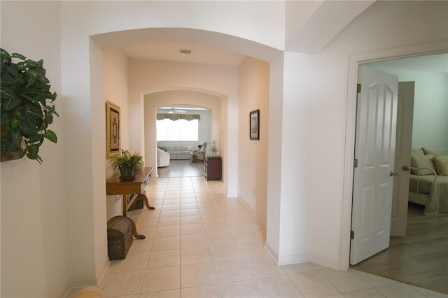 corridor with light tile patterned floors