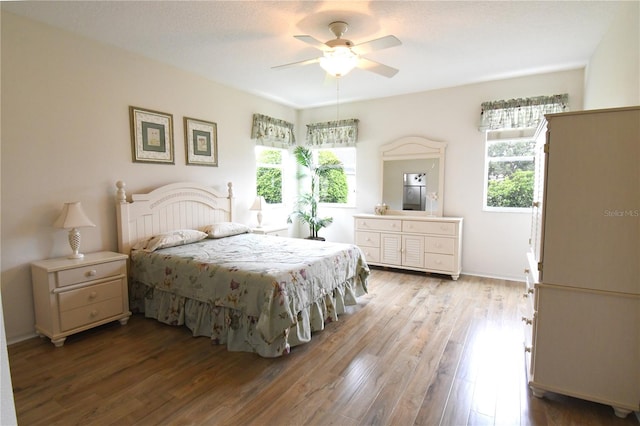 bedroom featuring ceiling fan and wood-type flooring