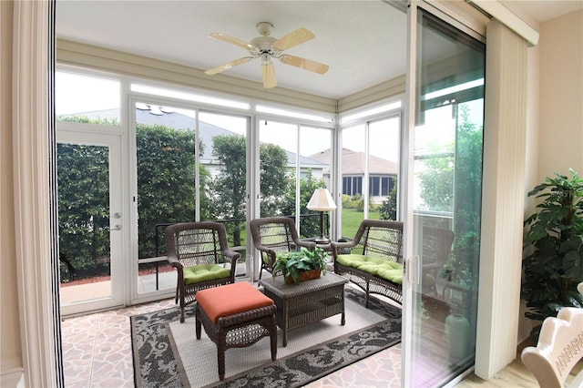 sunroom with ceiling fan, french doors, and a wealth of natural light