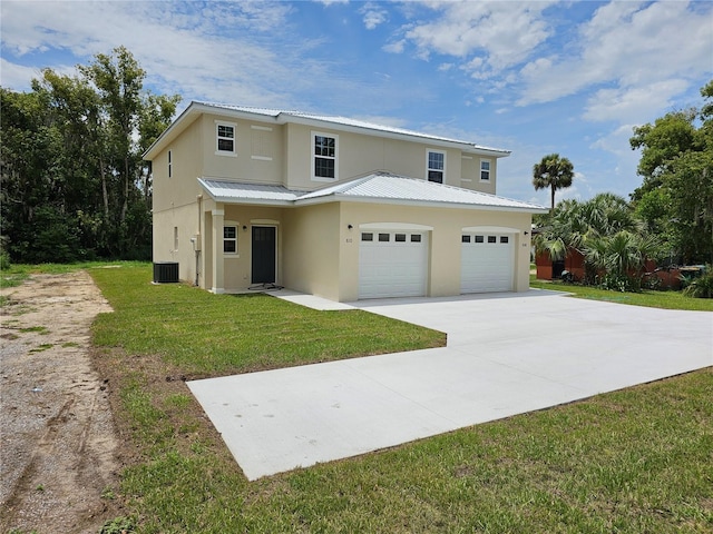 front facade featuring a front lawn, central air condition unit, and a garage