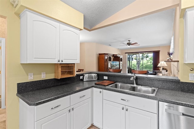 kitchen featuring kitchen peninsula, white cabinetry, dishwasher, and ceiling fan