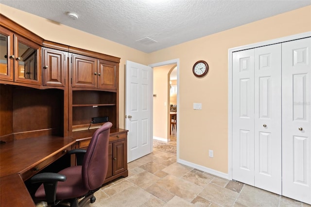 home office with a textured ceiling