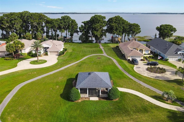 birds eye view of property with a water view