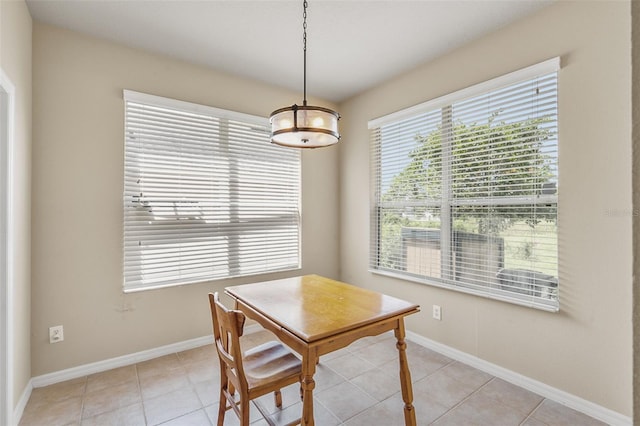 dining space with light tile patterned floors