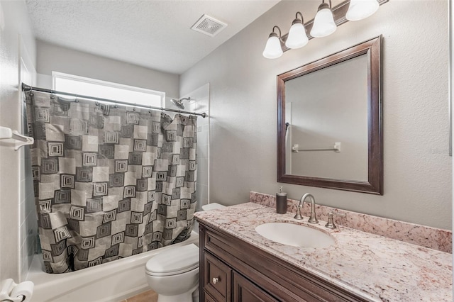 full bathroom with a textured ceiling, vanity, shower / tub combo, and toilet