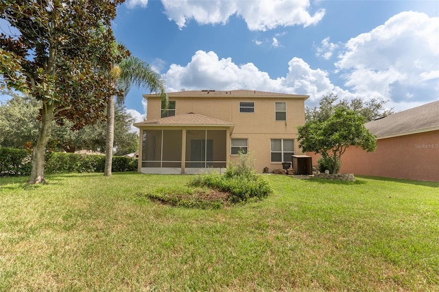 back of house with a yard, a sunroom, and central air condition unit