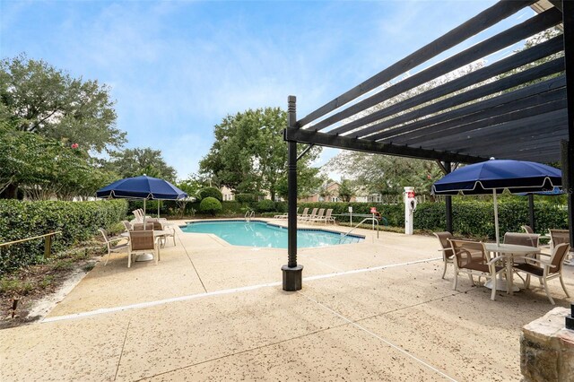 view of pool with a pergola and a patio