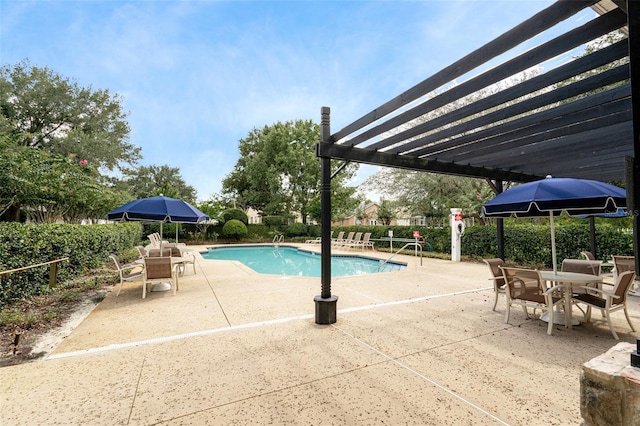 view of pool with a pergola and a patio area