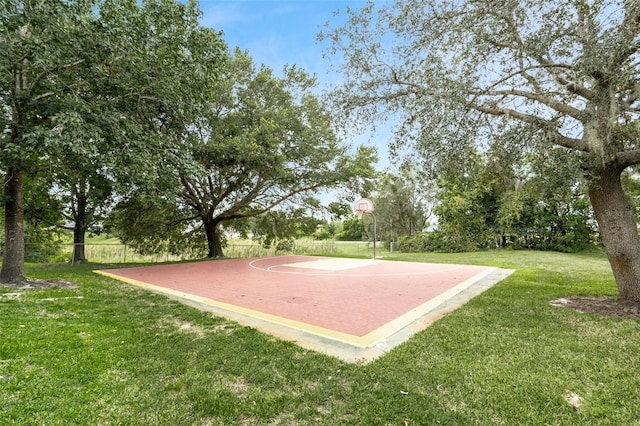 exterior space featuring basketball hoop