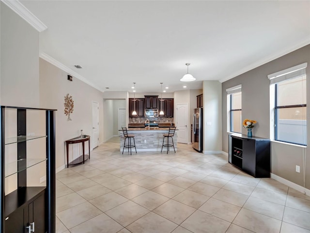 unfurnished living room with light tile patterned floors and crown molding