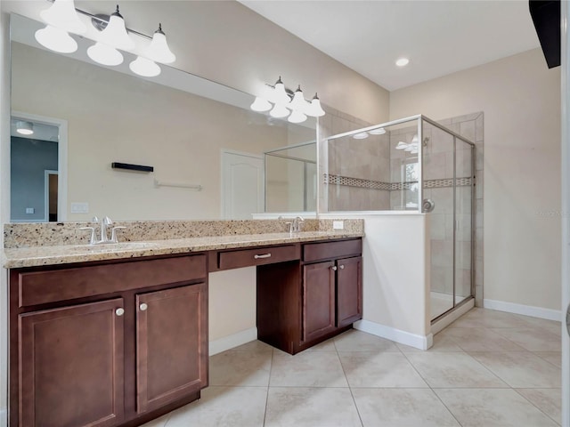 bathroom with tile patterned floors, an enclosed shower, and dual bowl vanity