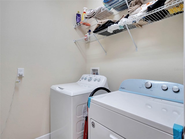 laundry area with independent washer and dryer