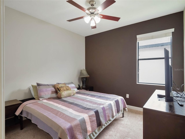 bedroom featuring ceiling fan and carpet flooring