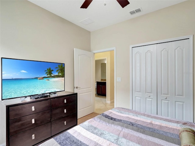 tiled bedroom with a closet and ceiling fan