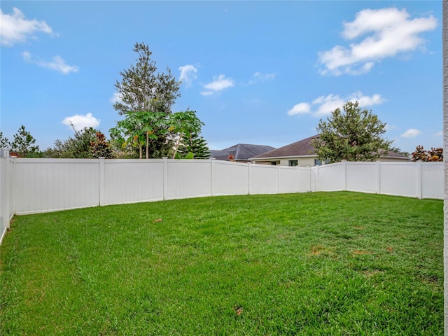 view of yard featuring a fenced backyard