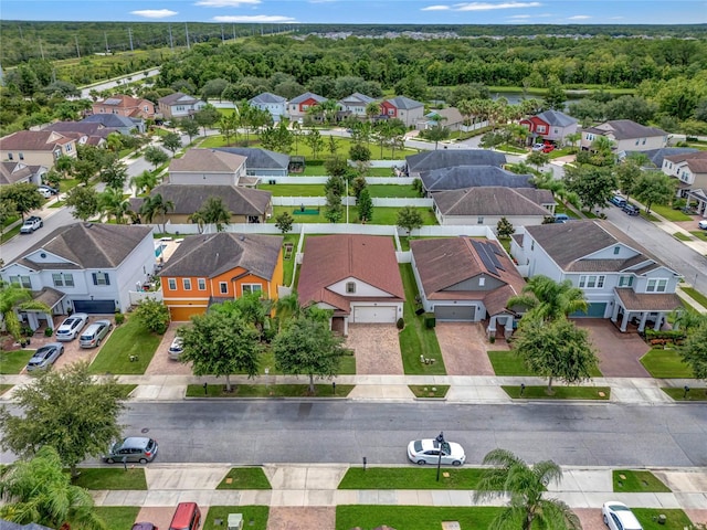 bird's eye view featuring a residential view and a view of trees