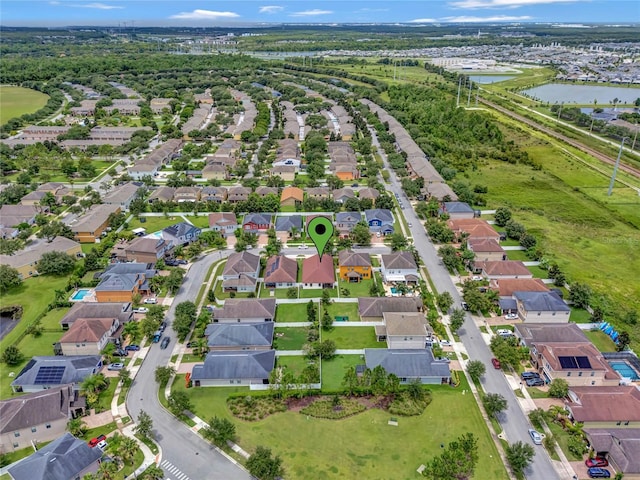 bird's eye view featuring a residential view and a water view