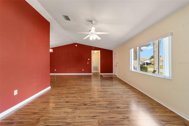 interior space featuring hardwood / wood-style flooring, ceiling fan, and vaulted ceiling