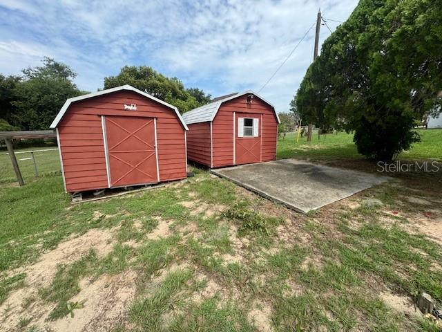 view of outbuilding with a lawn