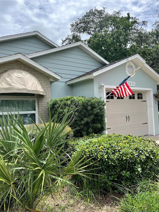 view of front of property featuring a garage