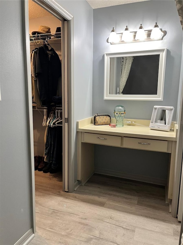 bathroom featuring vanity and wood-type flooring