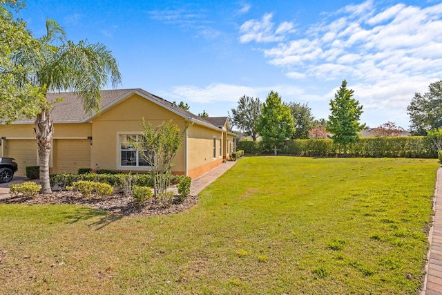 view of yard with a garage