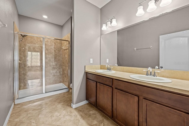 bathroom featuring a shower with shower door, double vanity, tile patterned flooring, and toilet