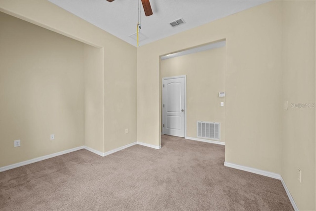 empty room with carpet and ceiling fan