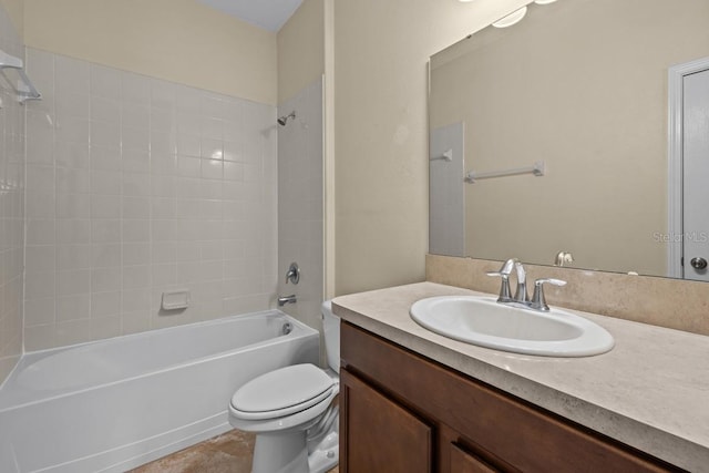 full bathroom with vanity, tiled shower / bath combo, toilet, and tile patterned flooring