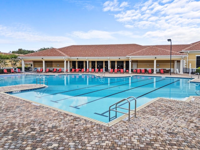 view of pool featuring a patio area