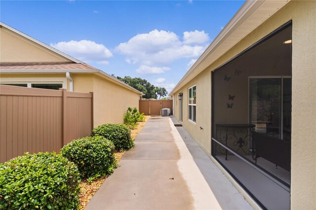 view of side of home featuring a patio area