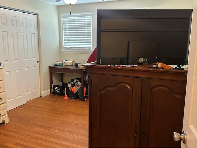 bedroom featuring light wood-type flooring and ceiling fan