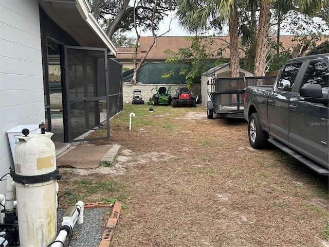 view of yard featuring a sunroom