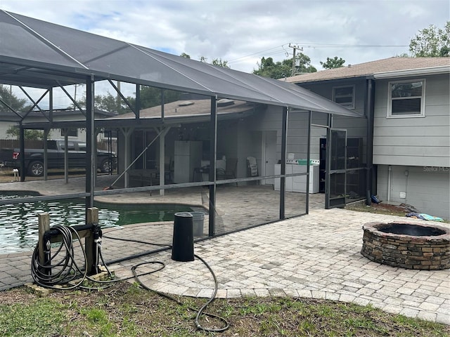 2524 Good Homes Rd, Orlando, FL 32818 - rear view of house with a fire pit, a lanai, a patio, and an outdoor pool