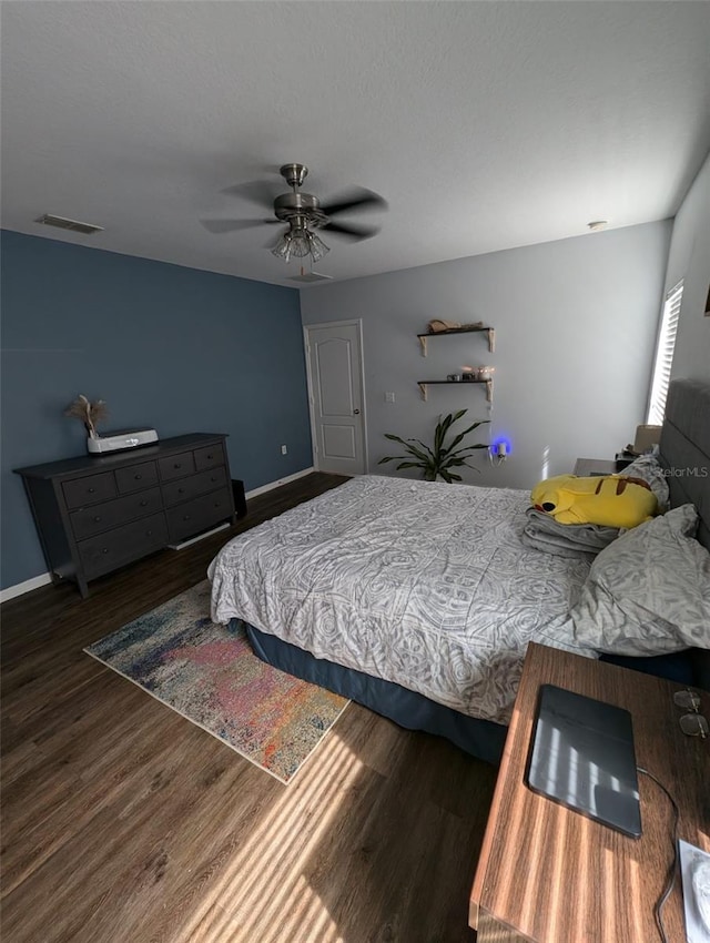 bedroom featuring hardwood / wood-style flooring and ceiling fan