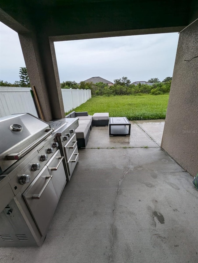 view of patio featuring a grill