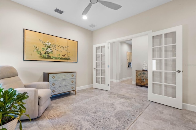 sitting room with ceiling fan, light tile patterned flooring, and french doors