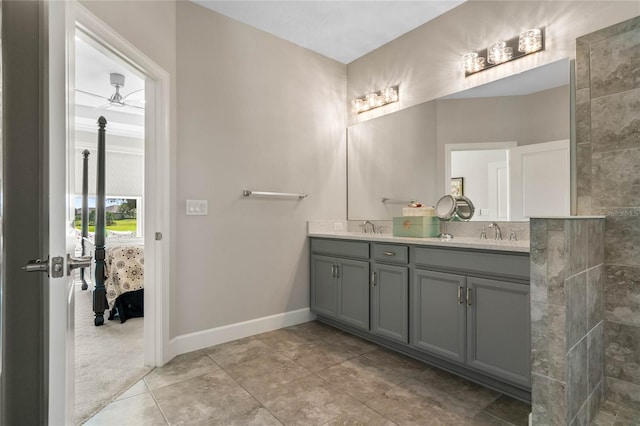 bathroom featuring ceiling fan, tile patterned flooring, and dual bowl vanity