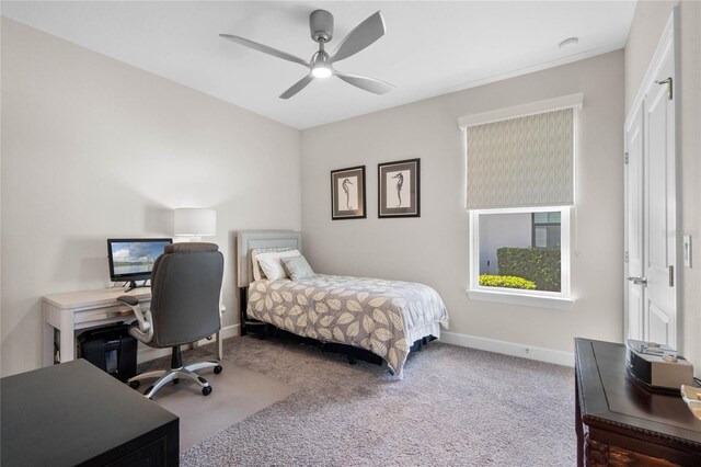 bedroom with ceiling fan and light colored carpet