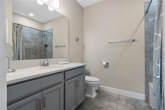 bathroom with tile patterned floors, vanity, and toilet