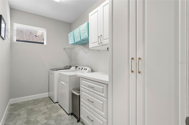 laundry room with independent washer and dryer, light tile patterned flooring, and cabinets