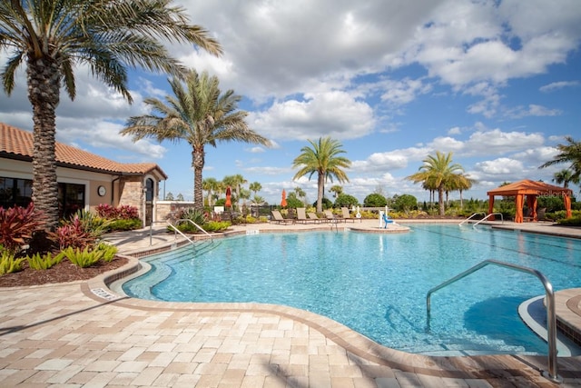 view of swimming pool with a gazebo and a patio area