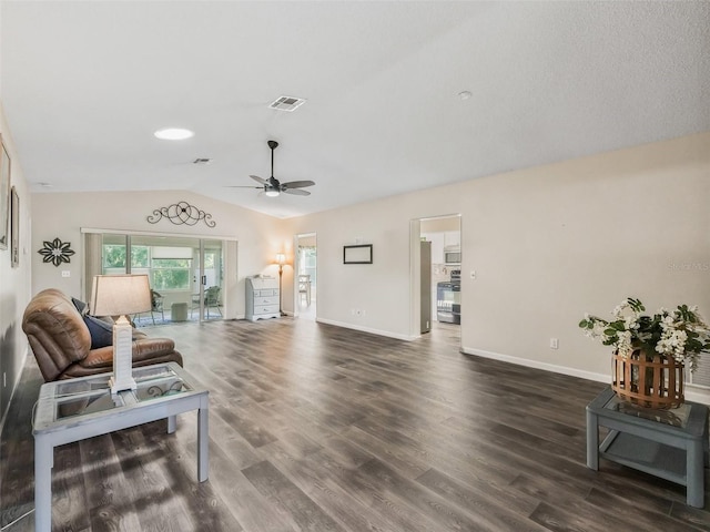 living room with vaulted ceiling, baseboards, dark wood finished floors, ceiling fan, and visible vents