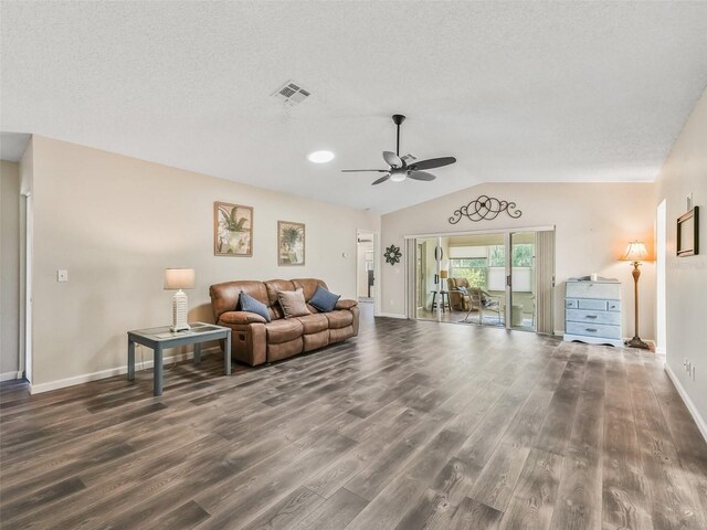 living room featuring ceiling fan, a textured ceiling, lofted ceiling, and hardwood / wood-style flooring