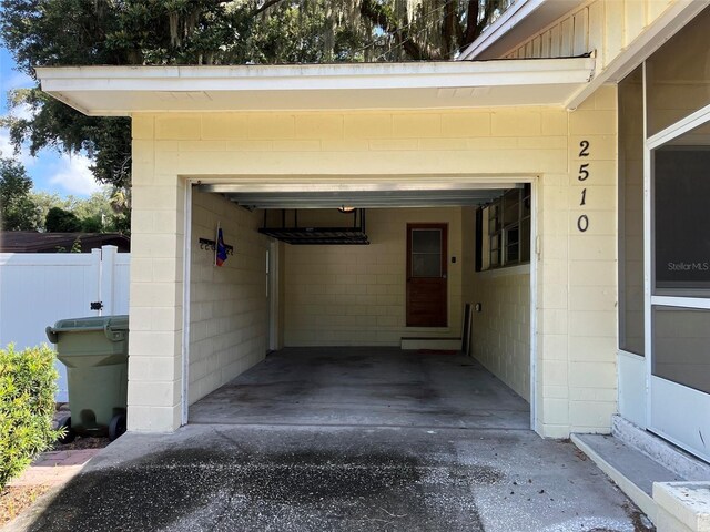 doorway to property featuring a carport