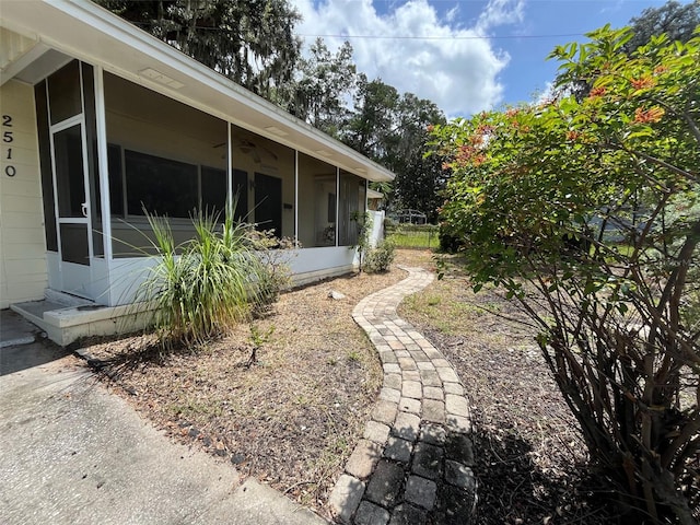 view of yard featuring a sunroom